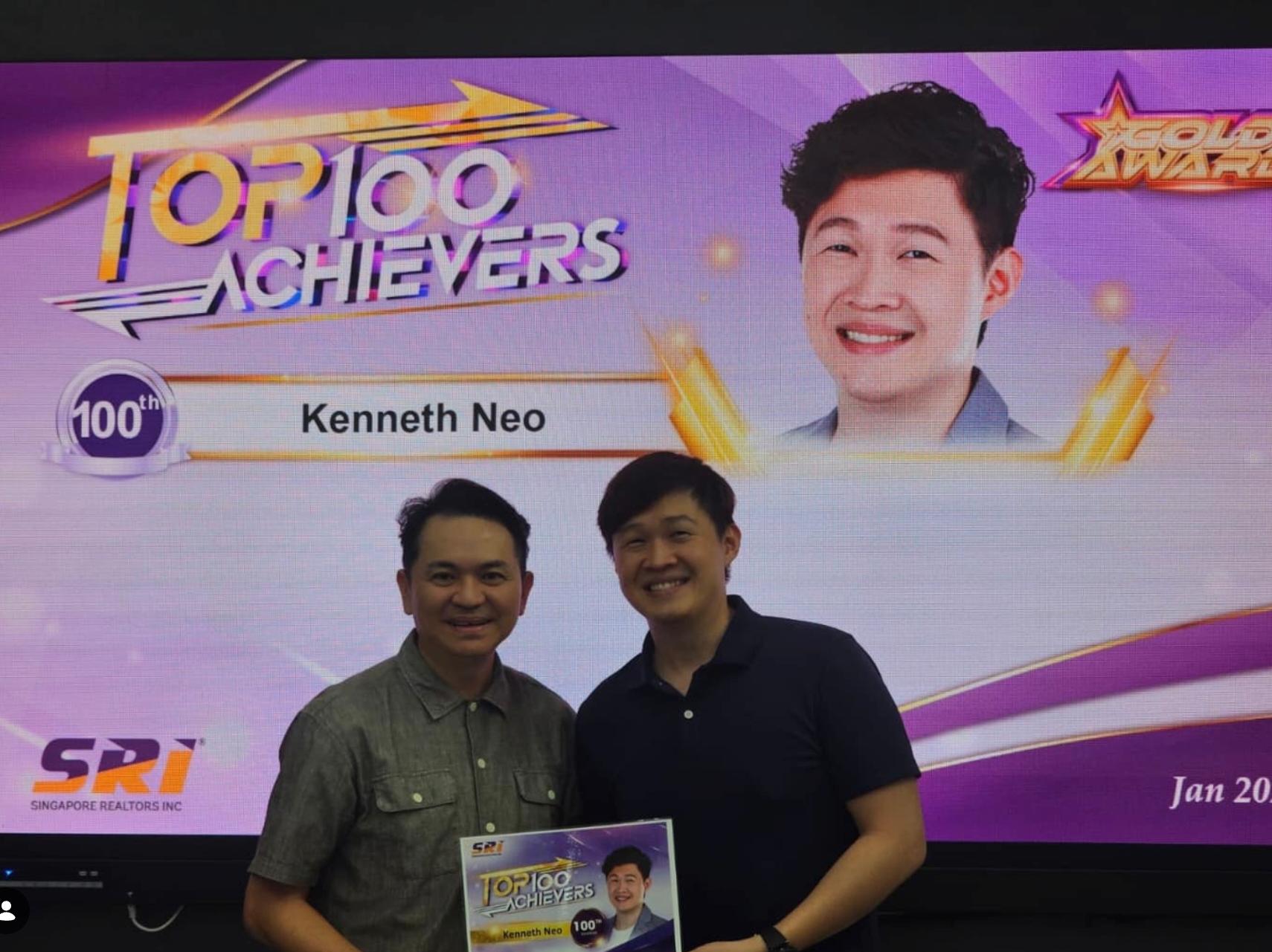 Kenneth Neo on stage receiving SRI Top 100 Achievers 100th Position plaque, January 2025